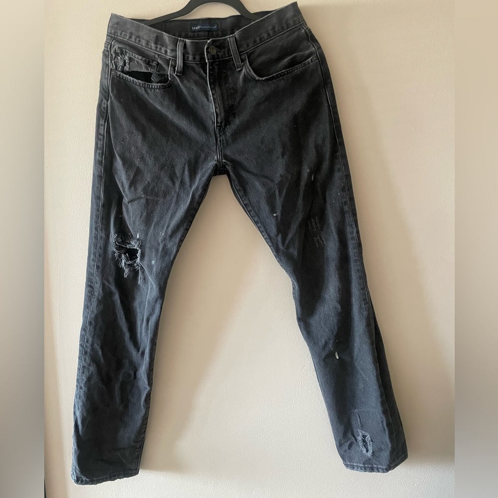 Levi’s 502 tapered distressed stain jeans